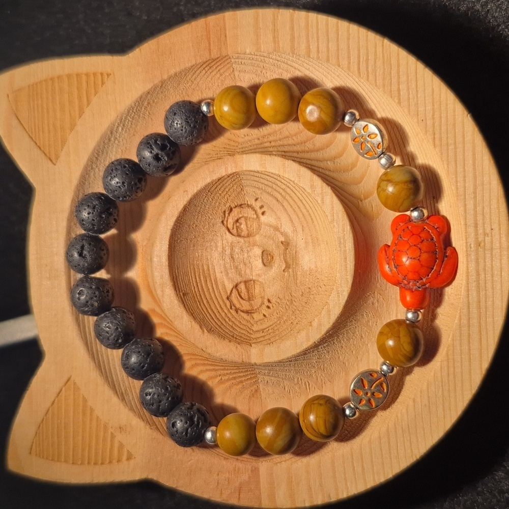 Petrified wood with orange turtle and lava beads